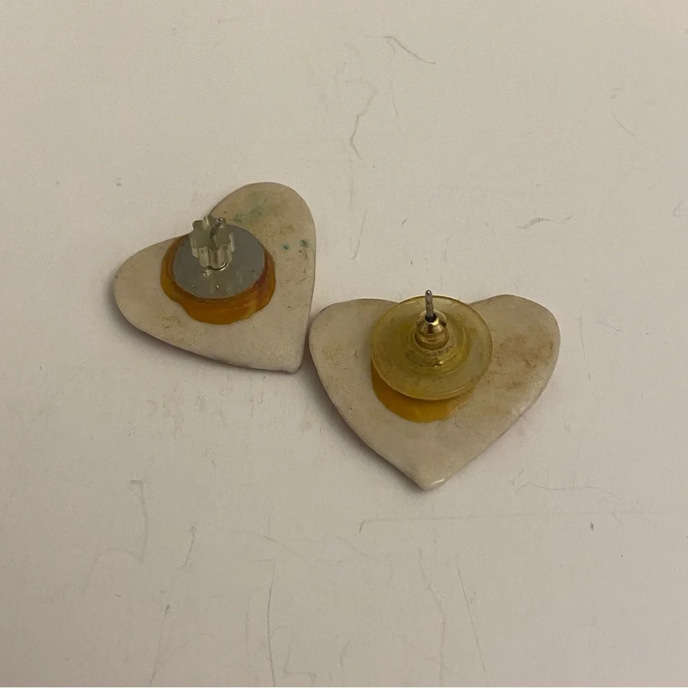 Two sets of heart earrings. Post earrings